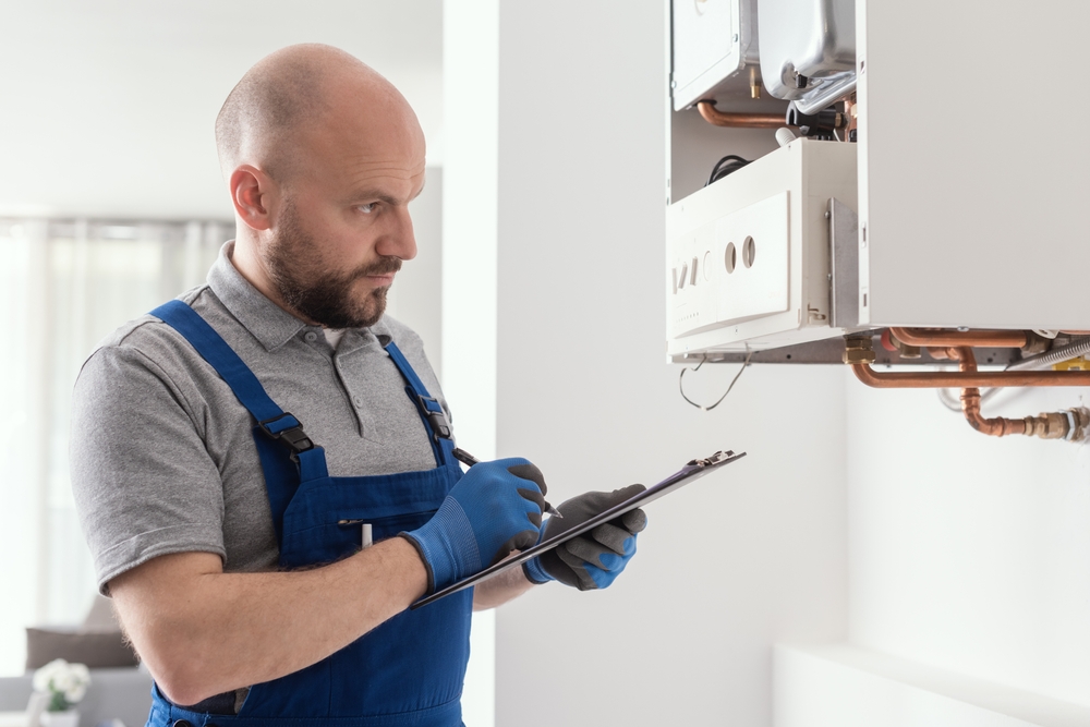 Engineer servicing a boiler